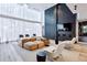 Bright and airy lounge with stylish seating and a large TV for relaxation and entertainment at 3324 Peachtree Rd # 1719, Atlanta, GA 30326
