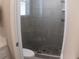 An updated bathroom with tiled walk-in shower and glass doors at 3630 Deaton Trl, Buford, GA 30519