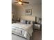 Bedroom with soft neutral walls and furniture creates a relaxing retreat at 3630 Deaton Trl, Buford, GA 30519