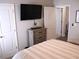 This bedroom features neutral decor, space, and a view to a seating area at 3630 Deaton Trl, Buford, GA 30519