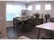 Bright dining room with a chandelier, hardwood floors, and stylish decor and a large window for natural light at 3630 Deaton Trl, Buford, GA 30519