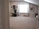 Spacious exercise room featuring fitness equipment, a window for natural light, and room for various activities at 3630 Deaton Trl, Buford, GA 30519