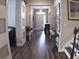 Elegant foyer featuring hardwood floors, a staircase, and stylish decor creates a welcoming atmosphere at 3630 Deaton Trl, Buford, GA 30519