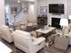 Cozy living room with a fireplace, plush seating, hardwood floors, and stylish decor for comfortable living at 3630 Deaton Trl, Buford, GA 30519