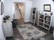 Inviting living room showcasing a stylish area rug, modern furnishings, and easy access to the staircase at 3630 Deaton Trl, Buford, GA 30519