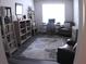 Bright office space featuring a desk, armchair, and bookshelves for an organized and productive work environment at 3630 Deaton Trl, Buford, GA 30519