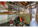 Unfinished basement with concrete block walls and ample storage space at 1602 Shamrock Se Trl, Smyrna, GA 30080