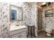 Charming bathroom with floral wallpaper and a sink, toilet and walk-in shower at 1602 Shamrock Se Trl, Smyrna, GA 30080