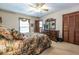 Comfortable bedroom featuring a floral bedspread, wood furniture, and a bright, airy feel at 1602 Shamrock Se Trl, Smyrna, GA 30080