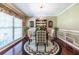 Elegant dining room with hardwood floors, chandelier, and decorative rug creates a perfect space for entertaining at 1602 Shamrock Se Trl, Smyrna, GA 30080