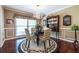 Charming dining room with hardwood floors and decorative hutch displays a refined and inviting atmosphere at 1602 Shamrock Se Trl, Smyrna, GA 30080