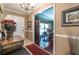 Entryway featuring tiled floors, chandelier, and doorway to formal living areas at 1602 Shamrock Se Trl, Smyrna, GA 30080