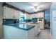Efficient kitchen with island features ample storage and a functional layout for easy meal preparation at 1602 Shamrock Se Trl, Smyrna, GA 30080