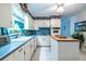 Bright kitchen with center island and updated appliances provides a comfortable and functional cooking space at 1602 Shamrock Se Trl, Smyrna, GA 30080