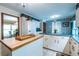 Well-equipped kitchen with island and adjacent dining area provides a versatile space for cooking and dining at 1602 Shamrock Se Trl, Smyrna, GA 30080