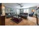 Comfortable living room features neutral walls, plush seating, and a ceiling fan at 1602 Shamrock Se Trl, Smyrna, GA 30080
