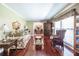 Cozy living room with hardwood floors and traditional furnishings showcases comfortable seating and a decorative mirror at 1602 Shamrock Se Trl, Smyrna, GA 30080