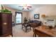 Cozy living room with a ceiling fan, comfortable seating, and natural light from the window at 1602 Shamrock Se Trl, Smyrna, GA 30080