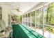 Screened porch features forest views, ceiling fan, and outdoor seating at 1602 Shamrock Se Trl, Smyrna, GA 30080