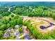 Aerial view of a home situated near lush, mature landscaping and community development at 1738 Honey Tree Pl, Hoschton, GA 30548
