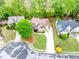 Aerial shot of a home showcasing its lush landscaping and long driveway at 1738 Honey Tree Pl, Hoschton, GA 30548