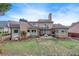 Spacious brick home showcasing a backyard with a pergola-covered patio at 1738 Honey Tree Pl, Hoschton, GA 30548