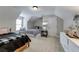 Upstairs bedroom with vaulted ceilings, two twin beds, and neutral decor, perfect for guests at 1738 Honey Tree Pl, Hoschton, GA 30548