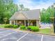 Community pool and clubhouse surrounded by mature trees at 1738 Honey Tree Pl, Hoschton, GA 30548