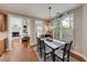 Cozy dining room with natural light, chandelier, and an adjacent sitting room at 1738 Honey Tree Pl, Hoschton, GA 30548