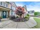 Attractive home featuring a brick facade, trimmed bushes, and a landscaped front yard at 1738 Honey Tree Pl, Hoschton, GA 30548