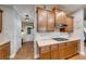 Functional kitchen space with ample counter space, cabinets and gas cooktop at 1738 Honey Tree Pl, Hoschton, GA 30548