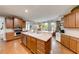 Spacious kitchen with stainless steel appliances, island sink, and plenty of storage at 1738 Honey Tree Pl, Hoschton, GA 30548