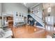 Spacious living room with an open floor plan, staircase, and abundant natural light at 1738 Honey Tree Pl, Hoschton, GA 30548