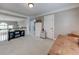 Spacious loft featuring carpeted floors, neutral paint, and an open railing overlooking the lower level at 1738 Honey Tree Pl, Hoschton, GA 30548