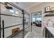 Beautiful walk-in shower with glass enclosure, rain shower head, and modern finishes at 1738 Honey Tree Pl, Hoschton, GA 30548