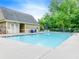 Sparkling community swimming pool surrounded by lounge chairs and well-kept grounds, perfect for relaxation at 1738 Honey Tree Pl, Hoschton, GA 30548