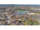 Wide aerial shot of the community area, which includes a running track and sports fields close to residential houses at 2651 Old Lost Mountain Rd, Powder Springs, GA 30127