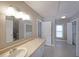Bathroom featuring large mirror, extended counter, and tile flooring at 2651 Old Lost Mountain Rd, Powder Springs, GA 30127