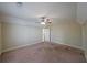 Large bedroom featuring a ceiling fan, neutral walls, carpet and a doorway at 2651 Old Lost Mountain Rd, Powder Springs, GA 30127