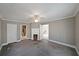 Spacious bedroom with carpet and view to bathroom and other rooms at 2651 Old Lost Mountain Rd, Powder Springs, GA 30127