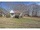 Charming home with a well-maintained front yard and classic architectural details at 2651 Old Lost Mountain Rd, Powder Springs, GA 30127