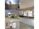 Bright kitchen featuring white cabinets, wood countertops and double sinks at 2651 Old Lost Mountain Rd, Powder Springs, GA 30127