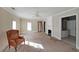 Spacious living room with neutral paint, ceiling fan, fireplace, and access to bathroom at 2651 Old Lost Mountain Rd, Powder Springs, GA 30127