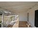 Inviting covered front porch with wooden decking and a view of the neighborhood at 2651 Old Lost Mountain Rd, Powder Springs, GA 30127
