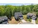 A lovely two-story home with a manicured lawn, attached garage, and a backdrop of lush trees at 312 Wichita Way, Mcdonough, GA 30253