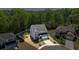 Aerial view of a two-story home with well-maintained landscaping and a driveway at 312 Wichita Way, Mcdonough, GA 30253