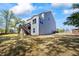 Back exterior of a two-story home, with a deck and stairs to the backyard at 312 Wichita Way, Mcdonough, GA 30253