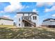 Back exterior of home featuring a deck, stair access to the backyard, and blue siding at 312 Wichita Way, Mcdonough, GA 30253