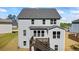 Two story home featuring a rear deck and manicured lawn at 312 Wichita Way, Mcdonough, GA 30253
