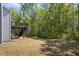 Beautiful backyard with lush green grass and privacy trees at 312 Wichita Way, Mcdonough, GA 30253